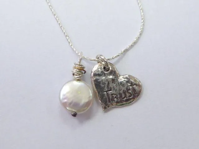 Elegant Sterling Silver Necklace with Heart-Shaped Pearl Pendant